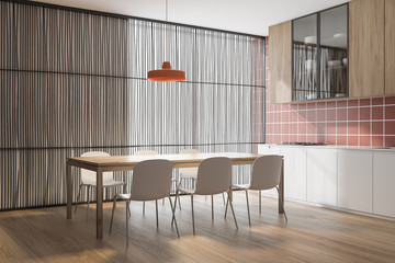 Orange tile kitchen corner with dining table