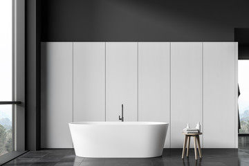 Black and white bathroom interior with tub