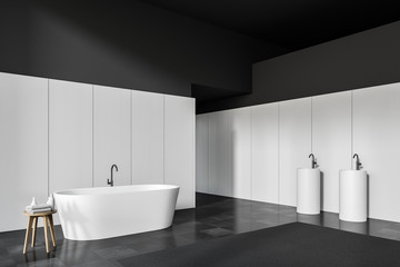 Black and white bathroom corner, tub and sink