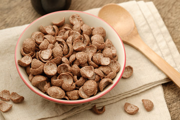 Cereals breakfast cocoa flavor in bowl on napery