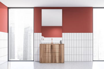 Red and white tile bathroom interior with sink