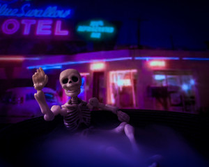Skeleton figure hanging out at a motel