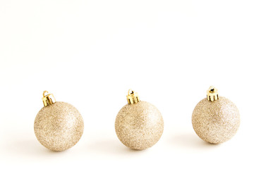 Golden Christmas decorations. Christmas balls Isolated on a white background. The concept of luxury winter holidays. Banner for the web page.