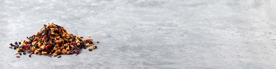 Dry tea leaves and dry fruits. A fruit tea. Close up, top view. 