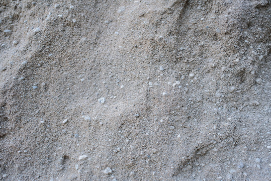 A Large Pile Of Gray Sand. Background. Texture.