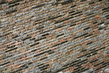 A wall of beautiful stone on the street. Background. Texture.