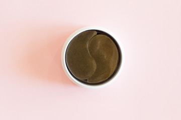 collagen for healthy and fresh skin. Skin care concept, anti-aging moisturizing eye mask, hydrogel patches. Patches for eyes and face. Eye pads. beauty treatment. cosmetics on a pink background.