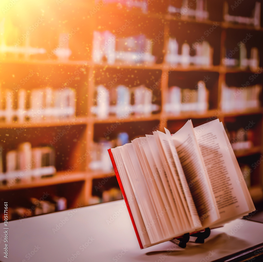 Poster stack of books in the library and blur bookshelf background
