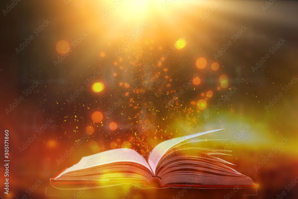 Poster imagine a picture book of an ancient book opened on a wooden table with a sparkling golden backgroun