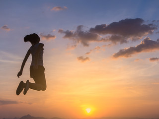 cheering happy young asian woman jumping and having fun. happiness and freedom concept for people enjoy the outdoor.
