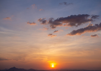 Fototapeta na wymiar Beautiful sunstset sky over the mountain with copyspace.