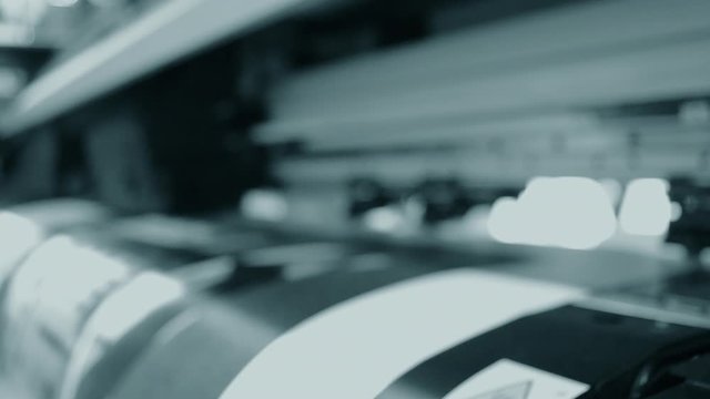 Blurred Background. Large format printer works close-up.
