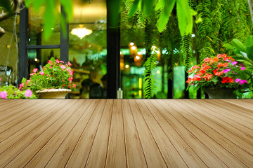 Wood floor for space use area have background plant in garden and flowe