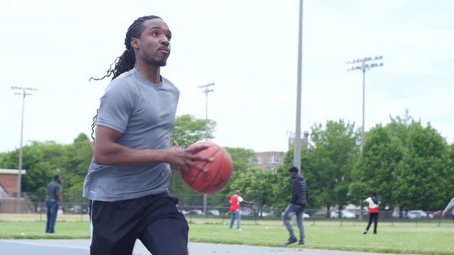 Man shooting a layup