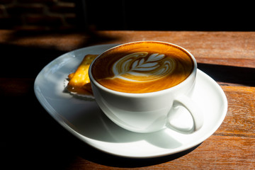 A cup of coffee in the morning with Latte Art.