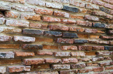  Old brick wall. Brick old fence during a sunny day.