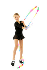 Girl gymnast performs exercises with tape.