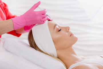 Contour plasticity of lips, augmentation of lips, introduction of filler of hyaluronic acid on...