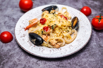 noodles with seafood in a white plate