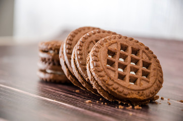 sandwich cookies on a wooden table. Close-up.
