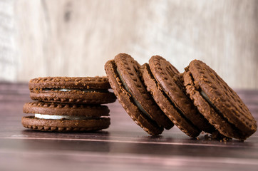 sandwich cookies on a wooden table. Close-up.