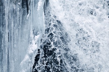 Beautiful mountain waterfall covered in ice