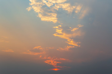 Golden yellow or orange gold sky tone and clouds at sunset or evening time.