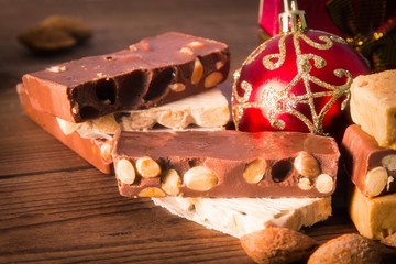 nougat, typical Christmas dessert on wooden background