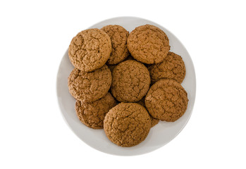 oatmeal cookies in a plate isolated on white. View from above.