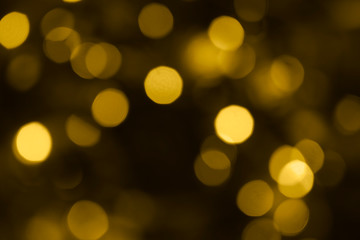 Abstract blurry gold bokeh lights Christmas background