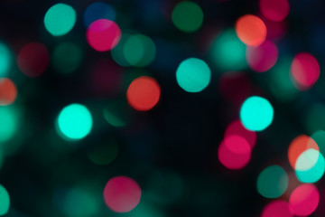 Festive christmas blurred lights teal green and pink bokeh background