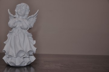 Angel white statue isolated on surface