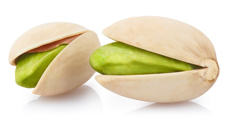 Close-up of tasty pistachios, isolated on white background