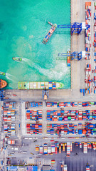 Top view of Deep water port with cargo ship and containers. It is an import and export cargo port where is a part of shipping dock and export products worldwide - obrazy, fototapety, plakaty