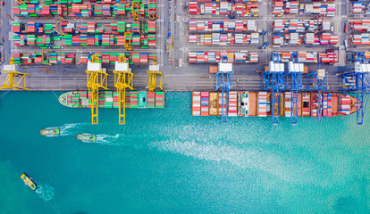 Fototapeta na wymiar Top view of Deep water port with cargo ship and containers. It is an import and export cargo port where is a part of shipping dock and export products worldwide