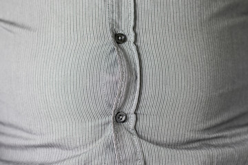 Fat belly under a striped shirt