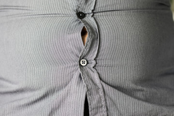 Fat belly under a striped shirt