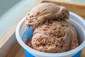 chocolate chip ice cream in white cup.