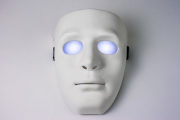 White mask with glowing eyes