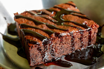 Chocolate brownie in iron plate.