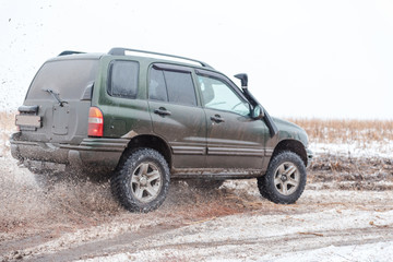 off-road driving. in a jeep on the first snow. car in the mud. driving through the mud in a simple car.