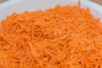 background grated carrots. carrots close-up. finely grated carrots. texture of carrots.