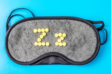 Sleeping pills on sleep mask, snoring.