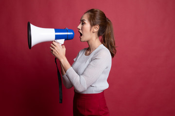 Beautiful young Asian woman announce with megaphone.