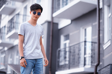 Asian fashion man outdoors in the city