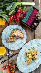 breakfast: chicken sandwich and omelet with asparagus