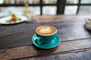 A cup of Coffee Latte on the table.