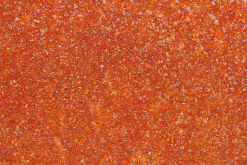 Iron surface in rust. The decline of industrial sectors. Rusty America Belt. Corrosion of metal. Red background or wallpaper. Reduced contrast. View from above. Close-up