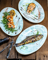 grilled seafood: salmon steak, tiger prawns, rainbow trout
