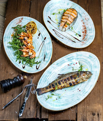 grilled seafood: salmon steak, tiger prawns, rainbow trout